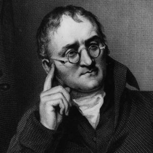 A 1823 dark engraving of John Dalton, leaning on his hand.